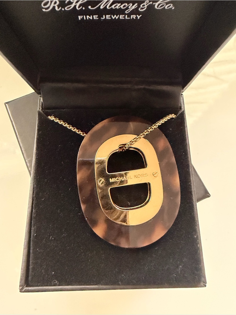 Michael Kors Gold Tortoiseshell Logo Pendant Necklace and matching bracelet